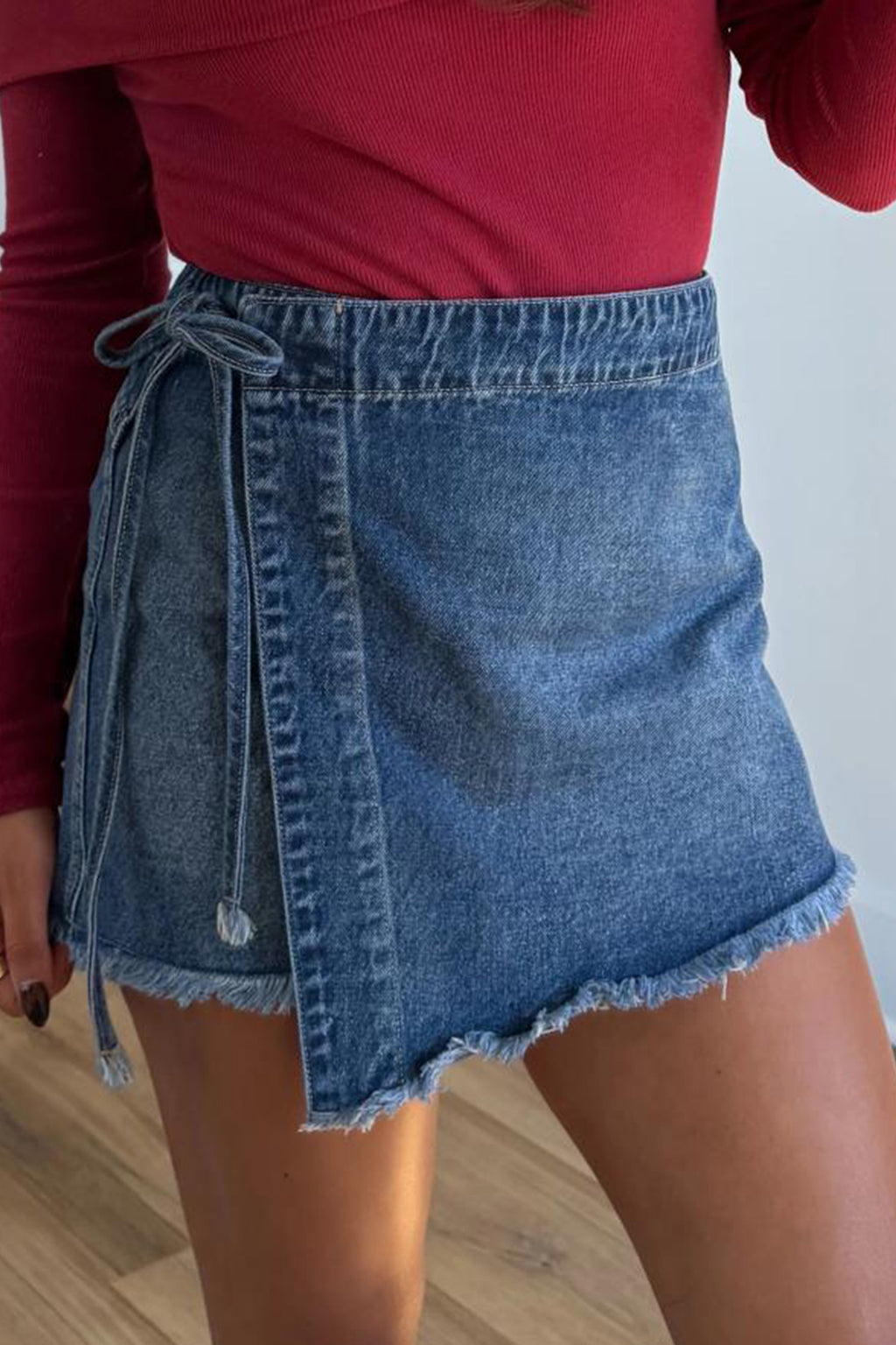 Shop Ashleigh Blue Wrapped Tied Waist Denim Skort at LivelyLooks