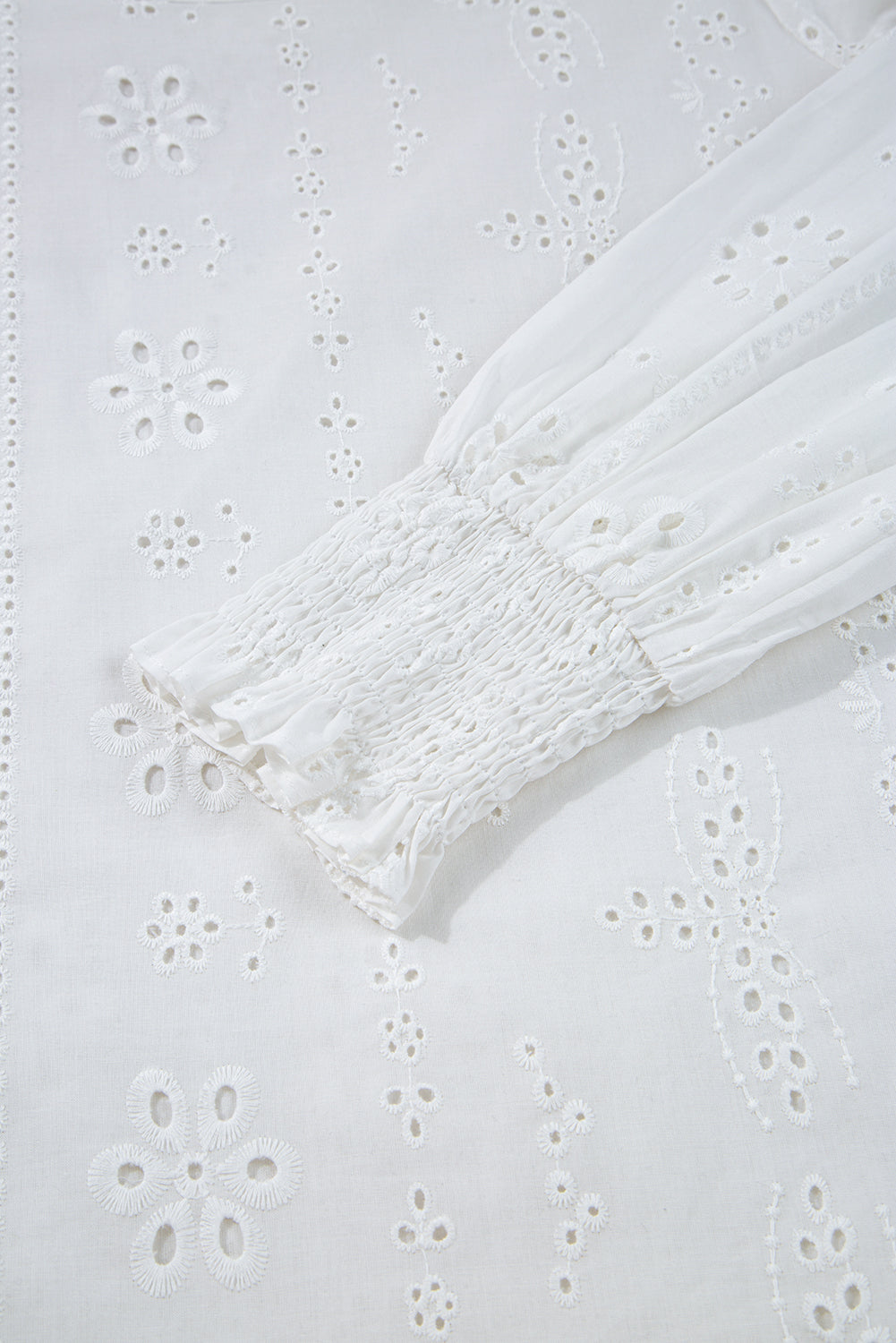 Shop White Eyelet Embroidered Smocked Cuff Sheer Blouse at LivelyLooks