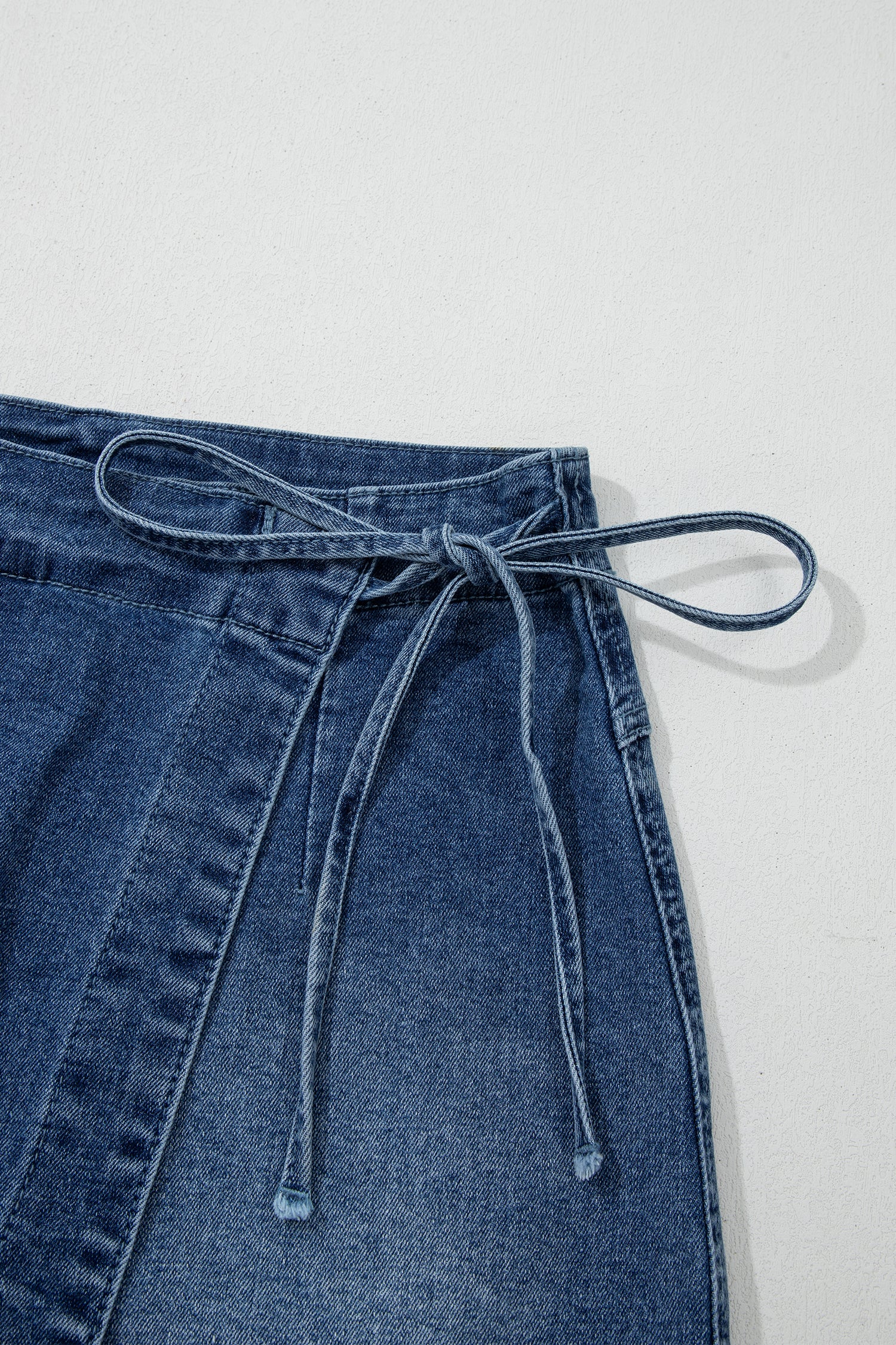 Shop Ashleigh Blue Wrapped Tied Waist Denim Skort at LivelyLooks