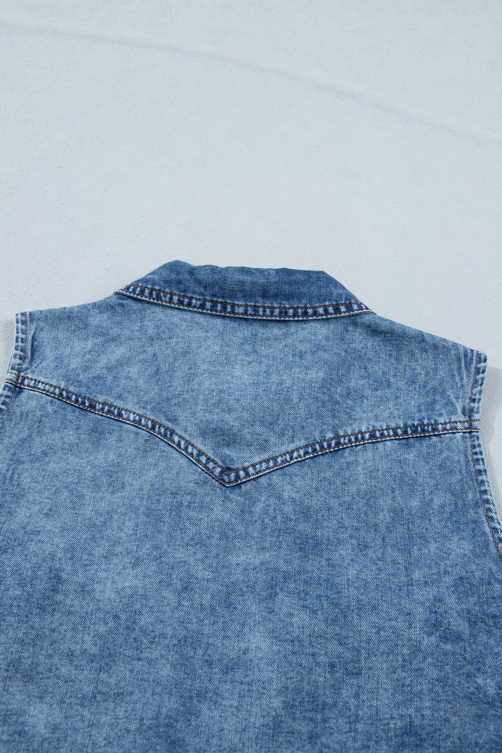 Shop Dusk Blue Buttoned Front Collared Sleeveless Denim Vest at LivelyLooks
