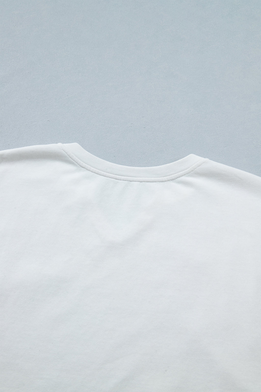 Shop White & Sky Blue Star Patch Notched Neck Mineral Wash Dolman Tee at LivelyLooks