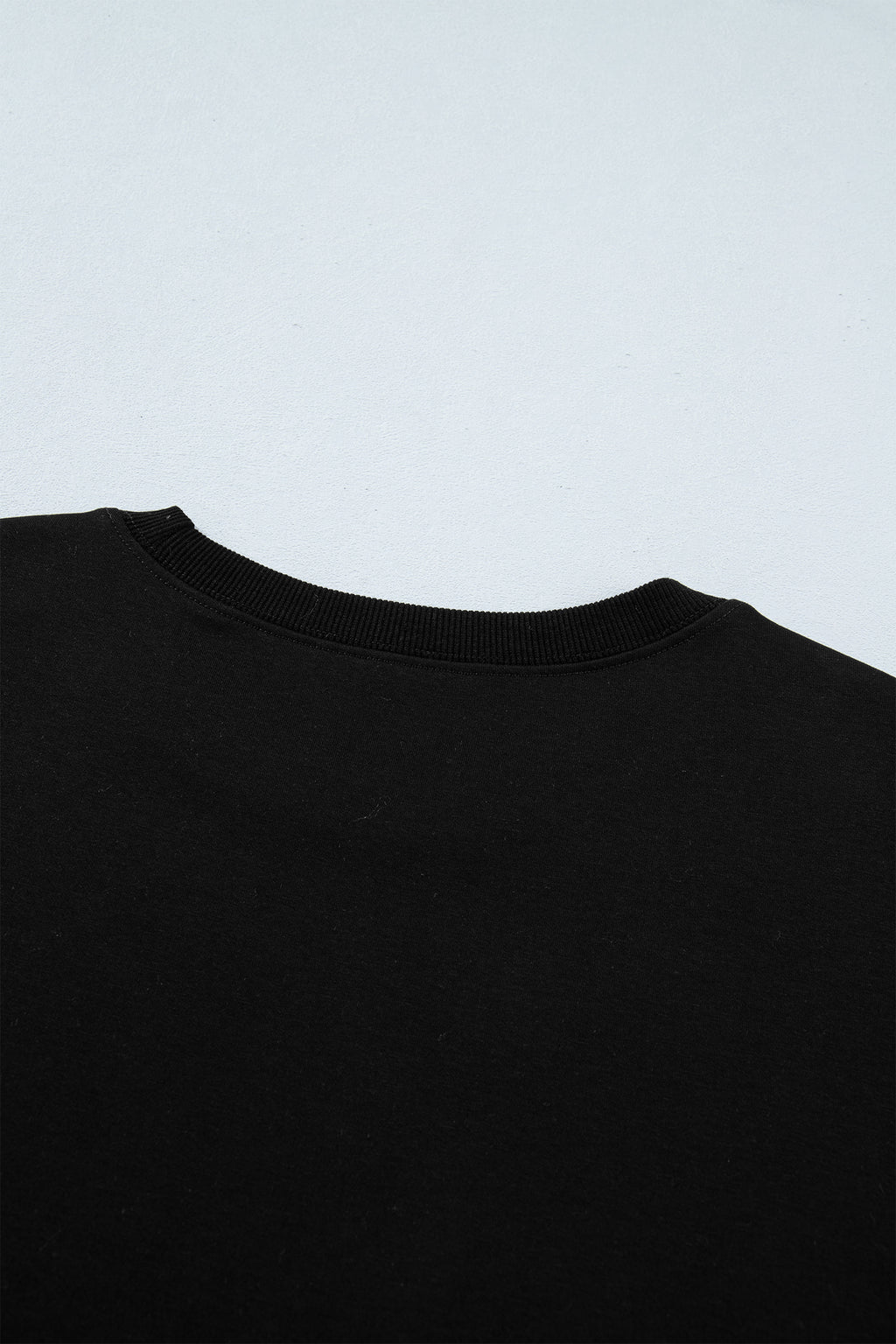 Women's Black Casual Solid Short Sleeve Top with Metal Button Details at LivelyLooks