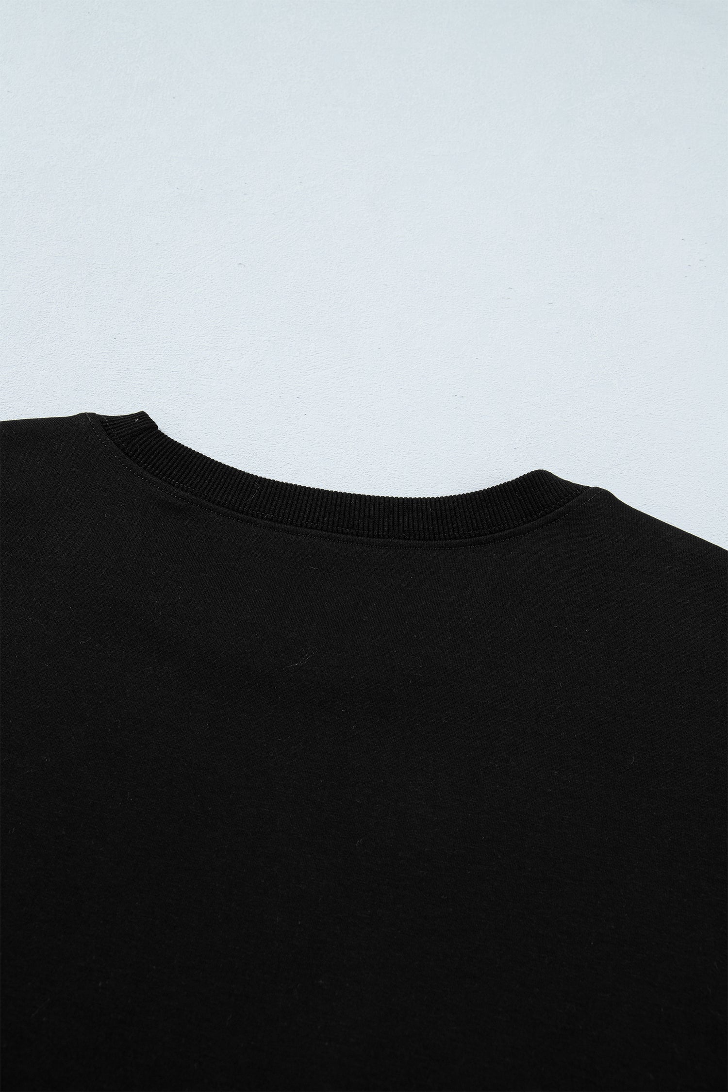 Women's Black Casual Solid Short Sleeve Top with Metal Button Details at LivelyLooks