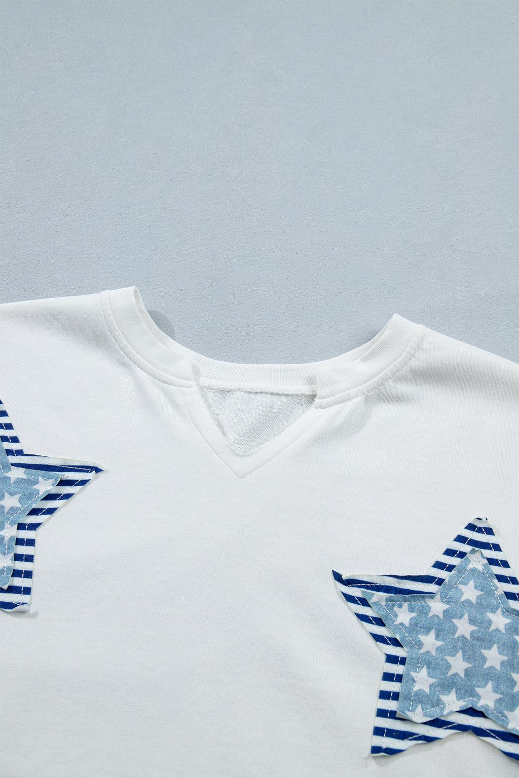 Shop White & Sky Blue Star Patch Notched Neck Mineral Wash Dolman Tee at LivelyLooks