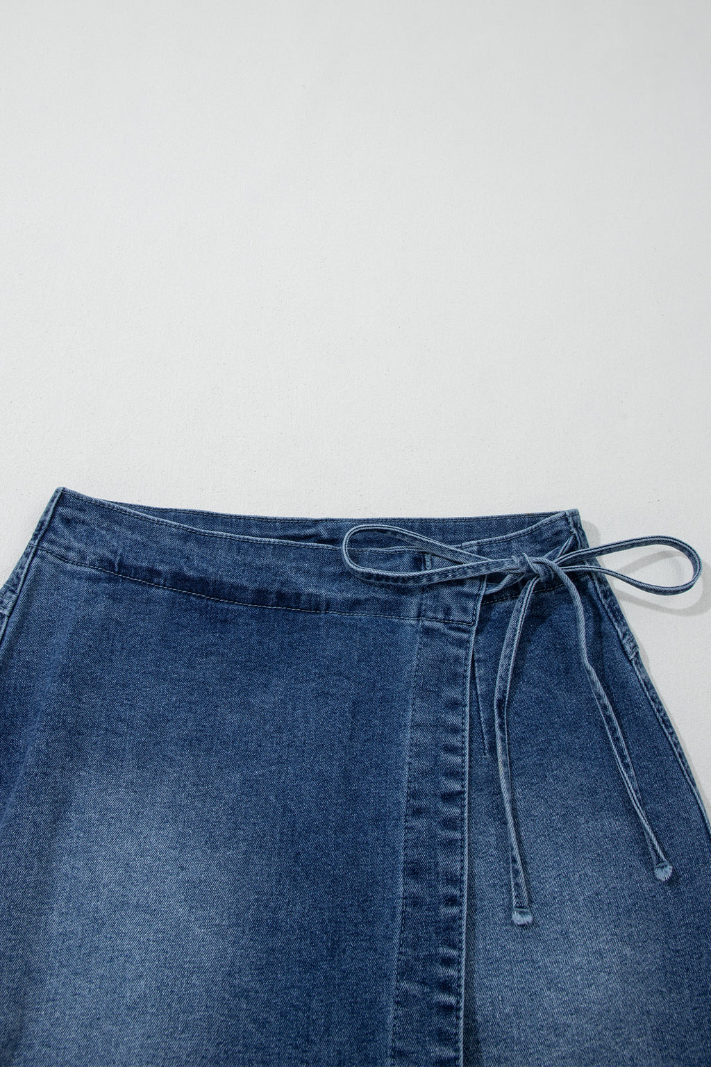 Shop Ashleigh Blue Wrapped Tied Waist Denim Skort at LivelyLooks